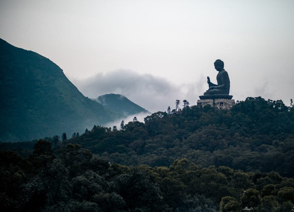 black and grey Buddha statue on top of hill