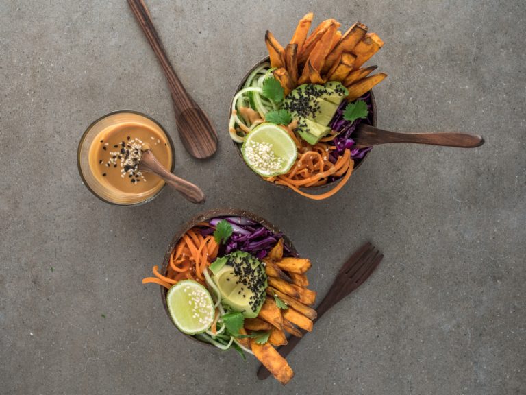 salad on brown wooden bowl with dip
